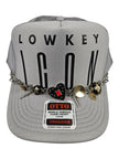 Lowkey Icon Silver Charm Trucker Hat