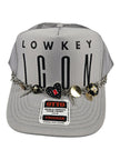 Lowkey Icon Silver Charm Trucker Hat